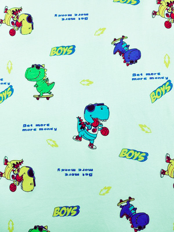 Discover the charming Super Cheap Fabrics Printed Jersey - Dino, showcasing cartoon dinosaurs on skateboards with sunglasses and hats. This light blue fabric features a playful two-way stretch and fun phrases like "Get more money" and "BOYS," perfect for stylish childrenswear.