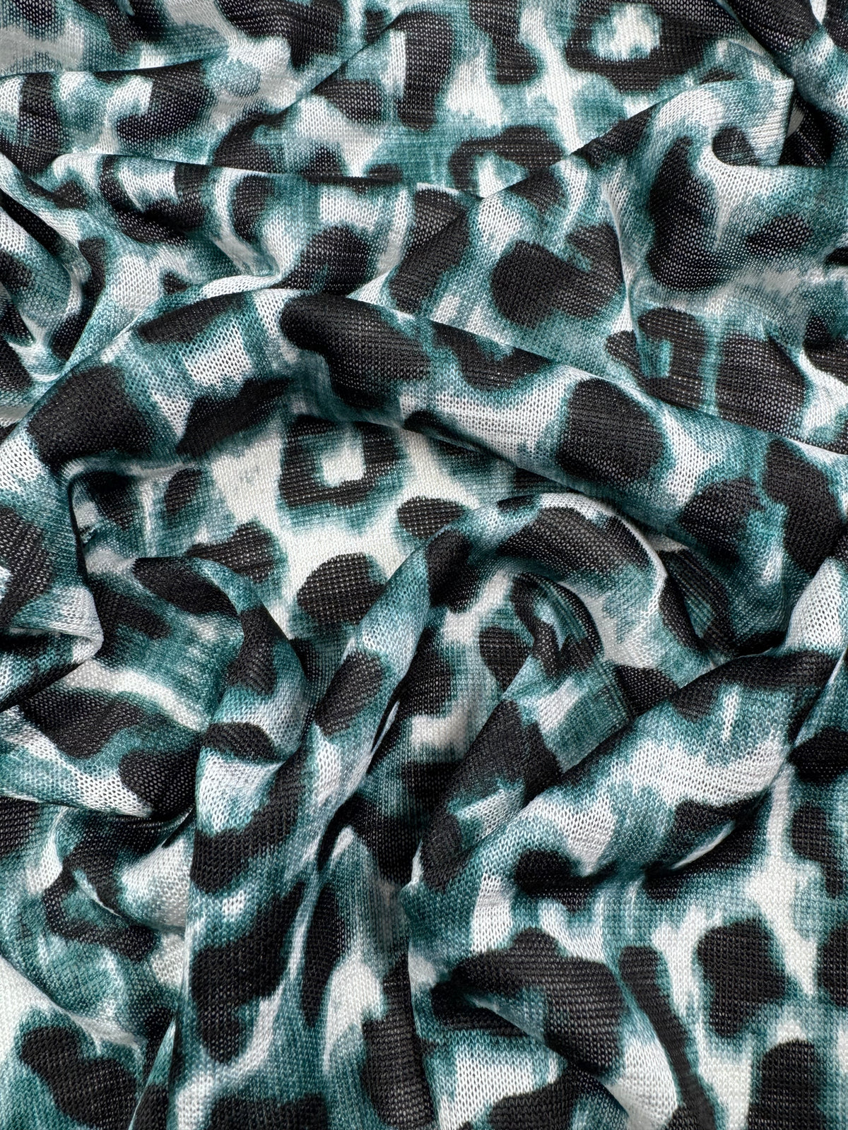 Icy Leopard textured knit fabric close up