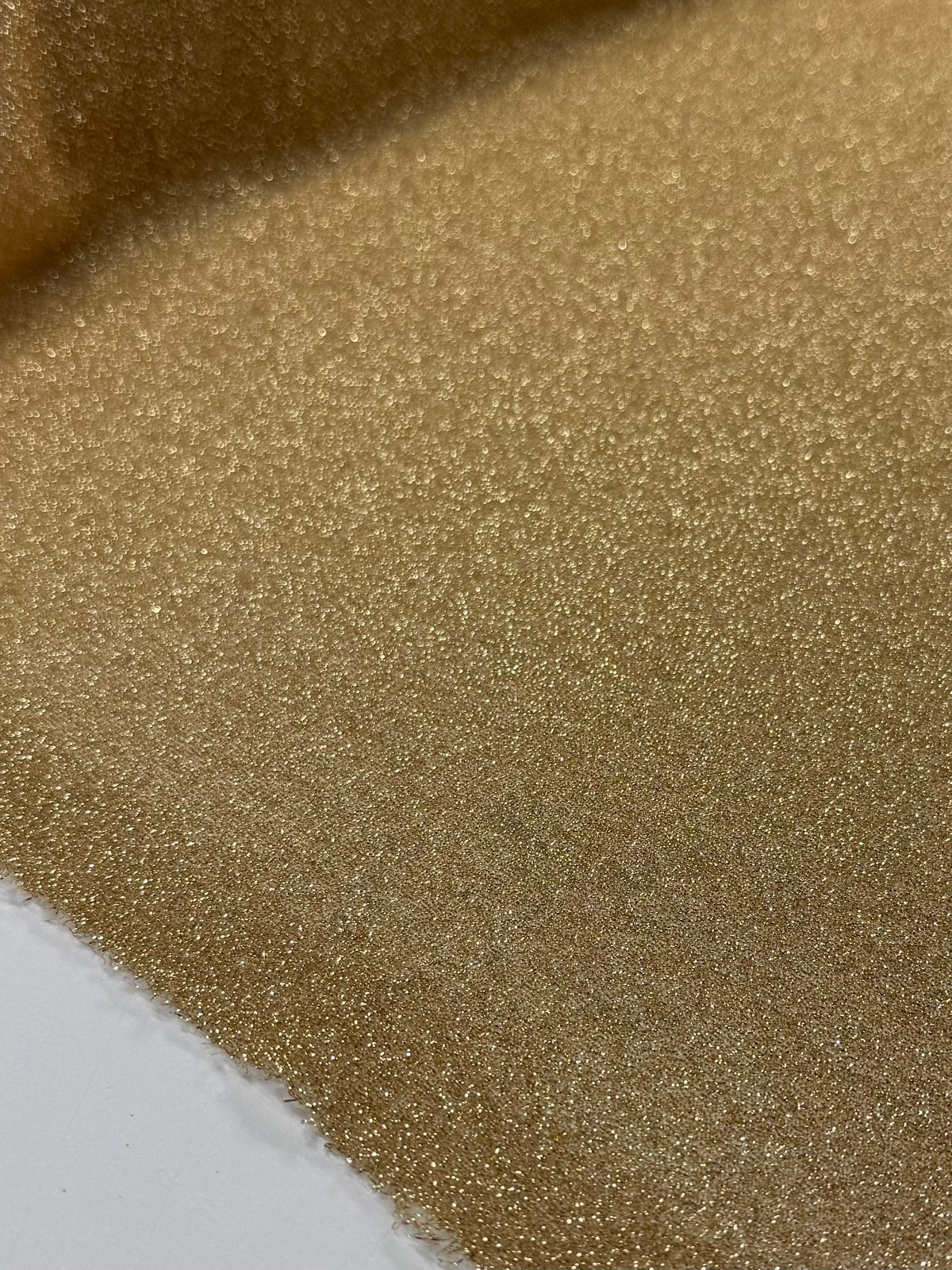 Gold metallic textured knit fabric weave detail