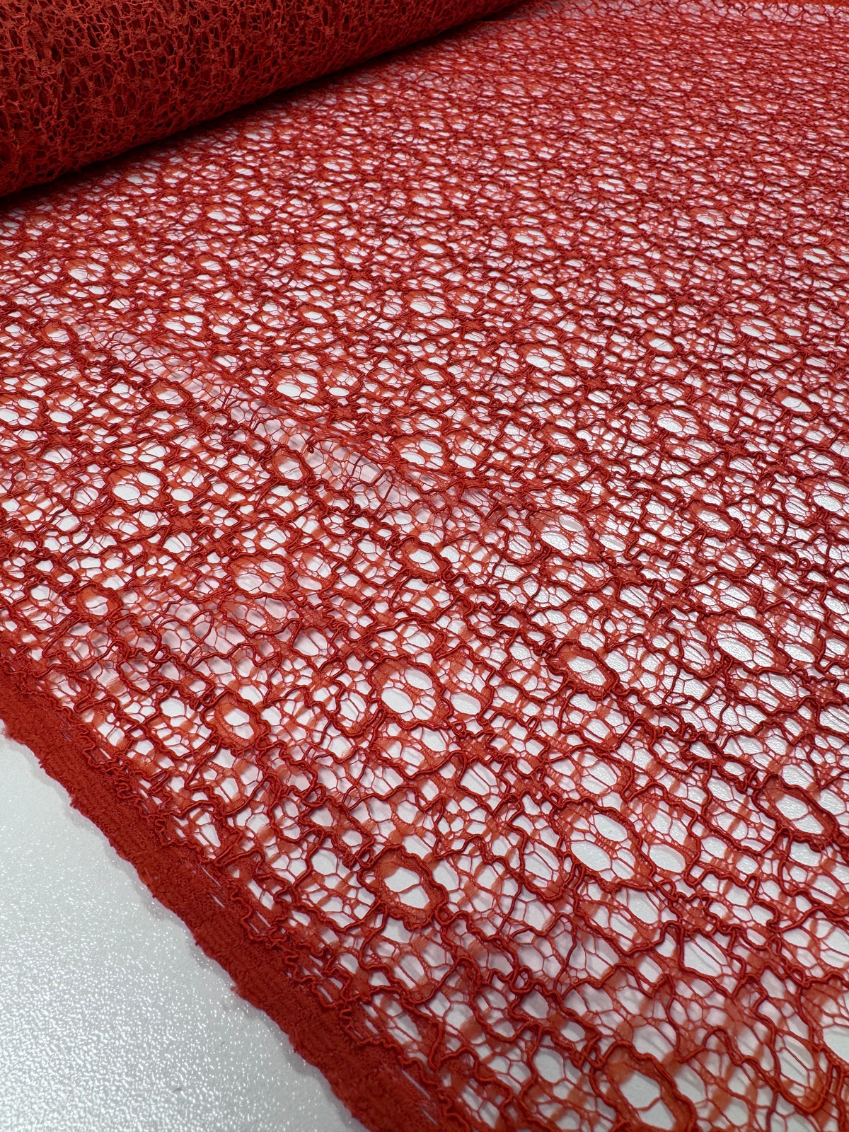 Orange cotton lace fabric weave detail