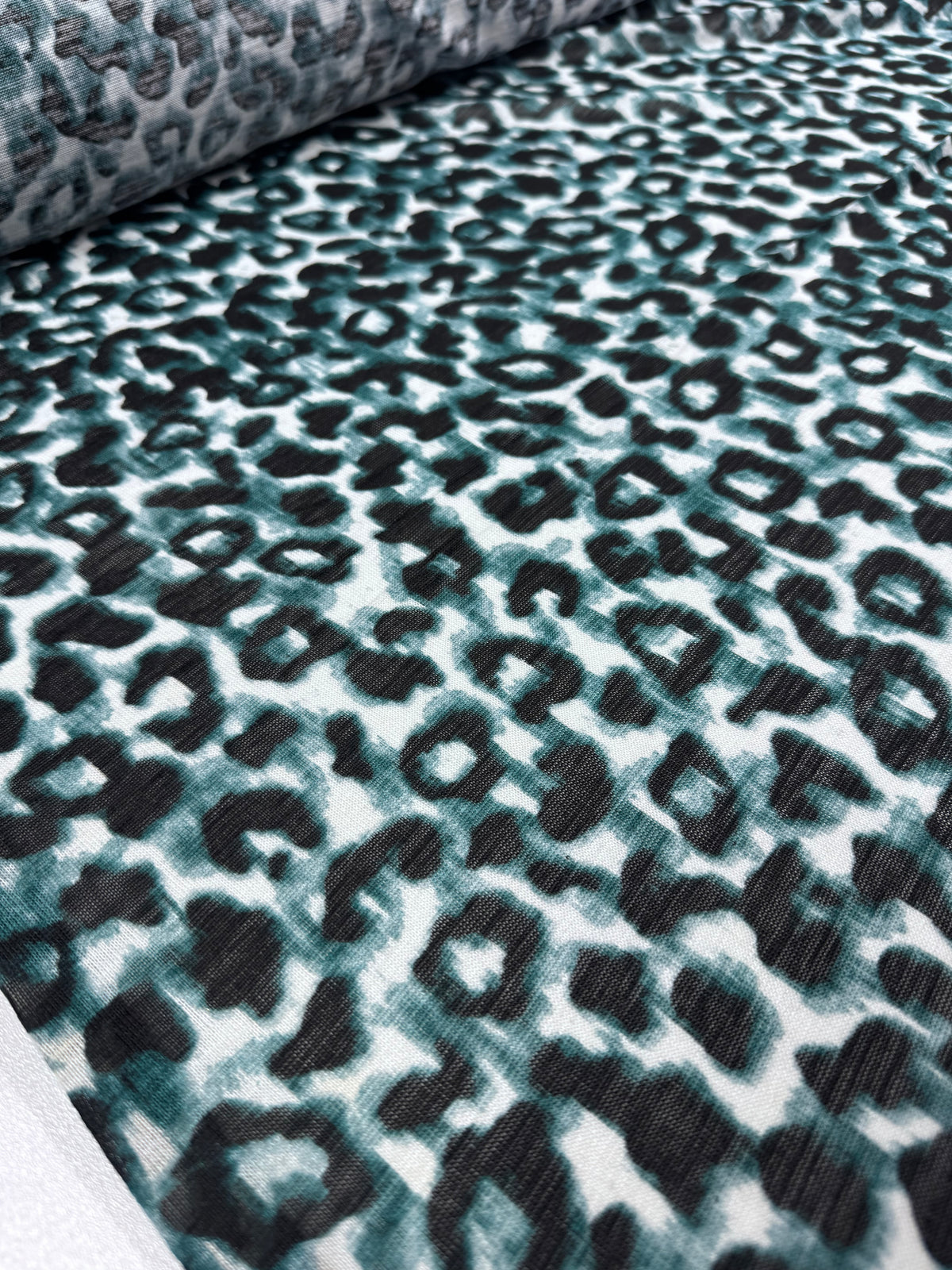 Icy Leopard textured knit fabric draped view