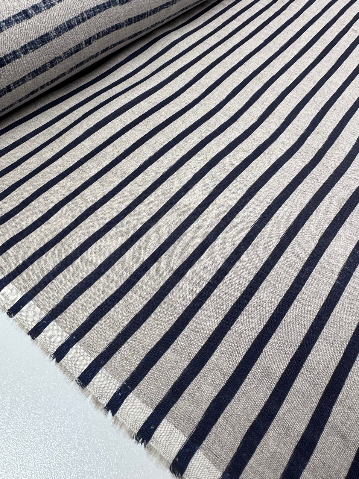 Detail of safari print on navy pure linen fabric