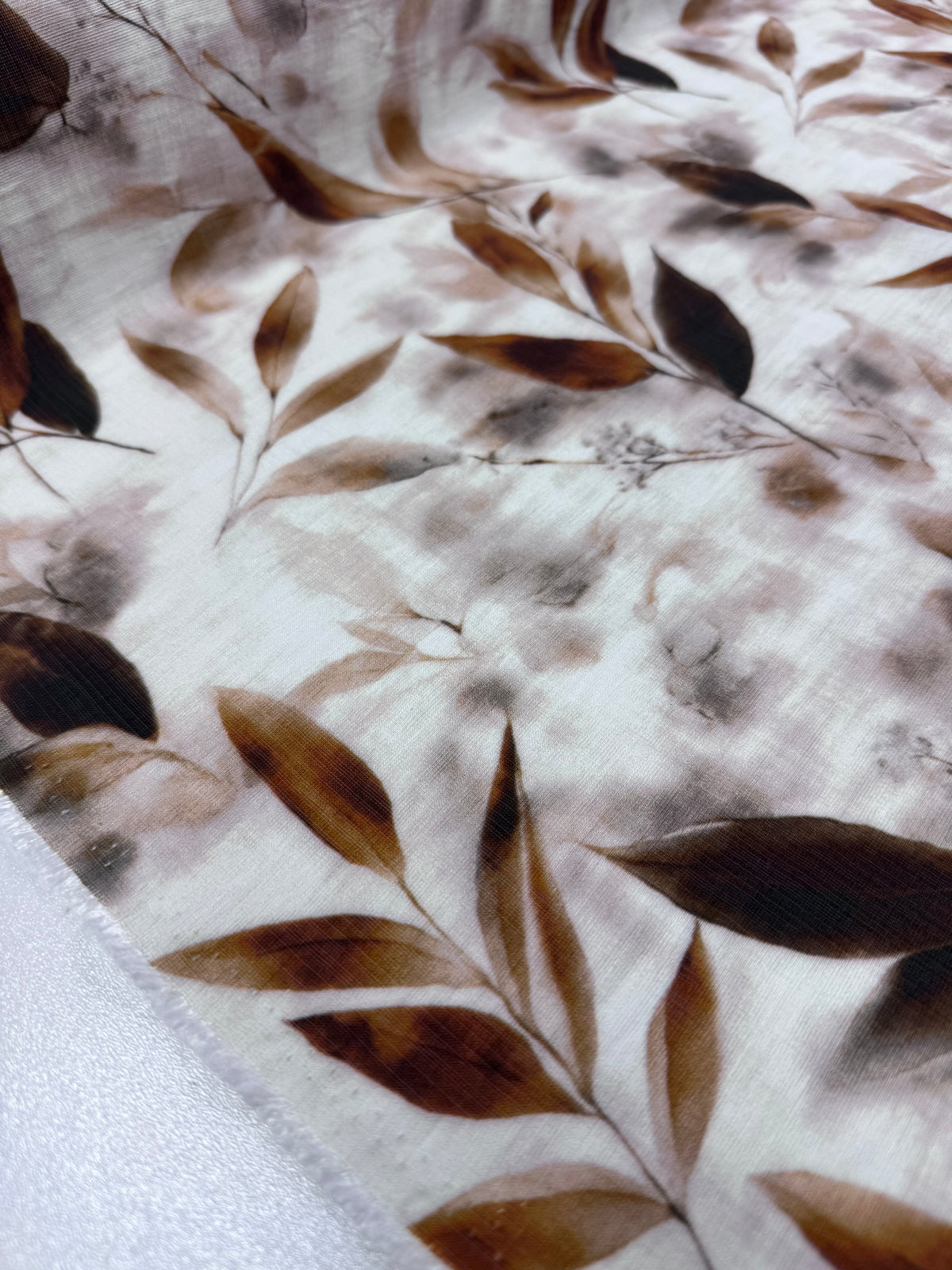 Mocha Leaves printed linen blend fabric draped view