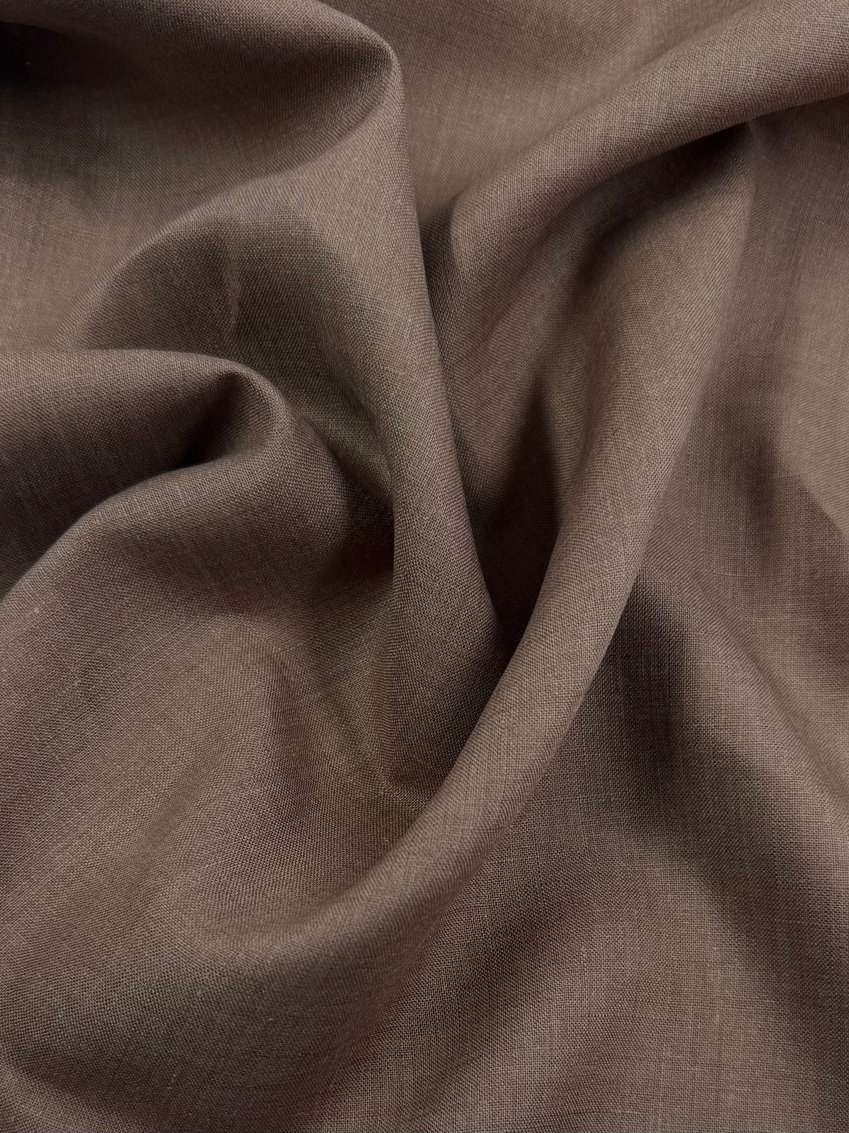 Close-up of mocha latte brown linen showing its natural weave