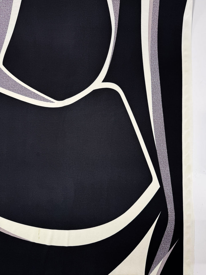 Super Cheap Fabrics' Viscose Knit - Curve - 145cm features an abstract, modern design with bold black, white, and gray curved and angular shapes, creating strong contrasts on soft knit fabric.