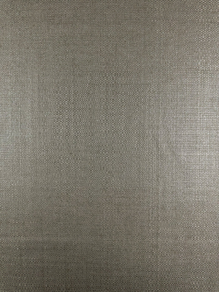 The Upholstery Basket Weave in Dorian Putty by Super Cheap Fabrics showcases a heavy-weight, textured fabric with a subtle woven pattern. The light beige color, with its slightly rough look and interlaced visible fibers, offers a uniform and neutral backdrop. Width: 145cm.