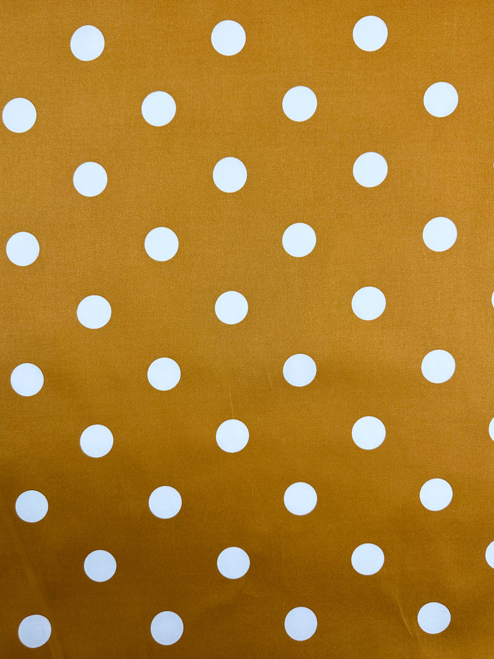 Super Cheap Fabrics' Cotton Sateen - Polka Yam, 125cm, features a delightful yellow with white polka dots, ideal for crafting charming dresses.