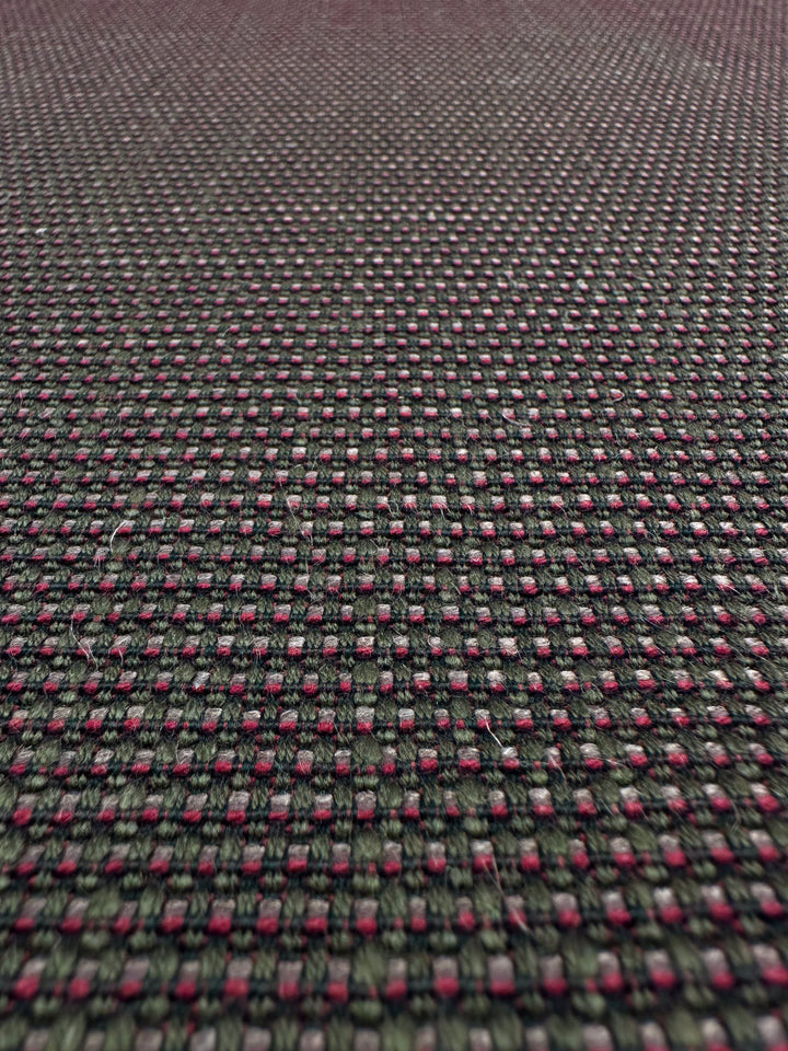 Close-up of Super Cheap Fabrics' Grid Upholstery - Yari 125 (147cm), featuring a durable, textured fabric with a dark green, red, and pink grid pattern—perfect for high-traffic furniture.