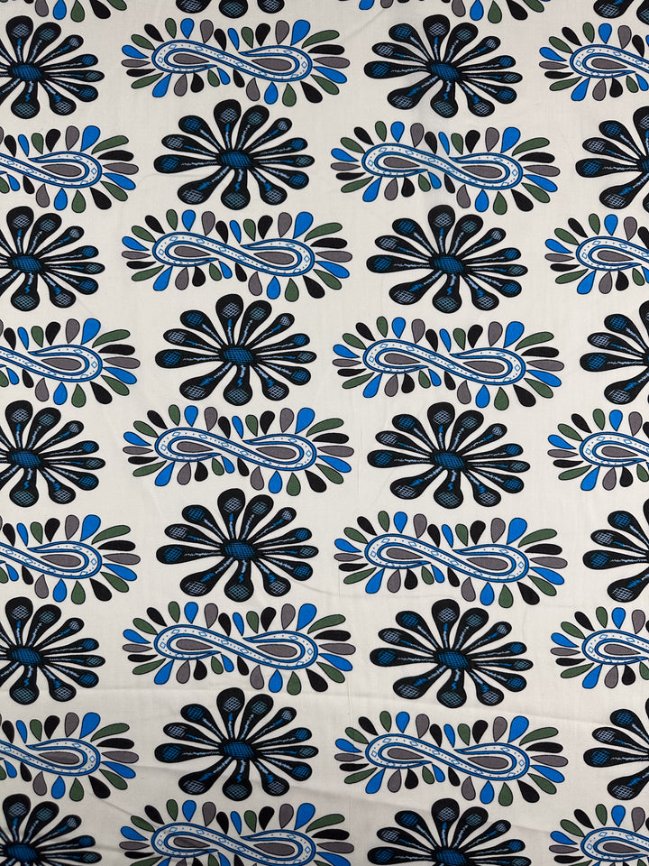 Designer Rayon - Dance - 145cm by Super Cheap Fabrics features a repeating abstract floral pattern in black, blue, and gray on white—ideal for vibrant prints and lightweight garments.