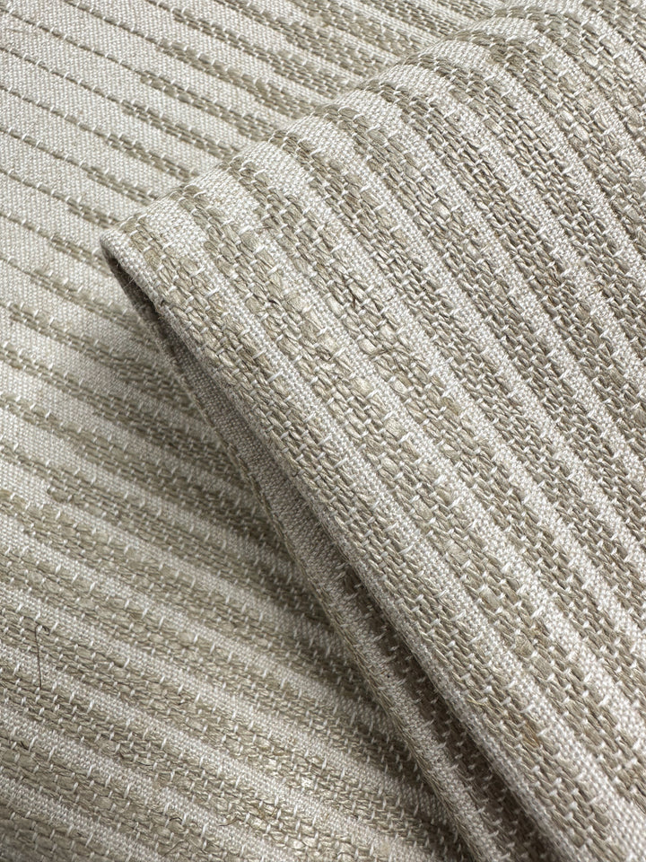 Close-up of Textured Jacquard Upholstery - Melmoth Stripe Nat (142cm) by Super Cheap Fabrics, featuring a beige ribbed pattern with a soft sheen—highlighting its thick, woven structure, perfect for premium upholstery projects.