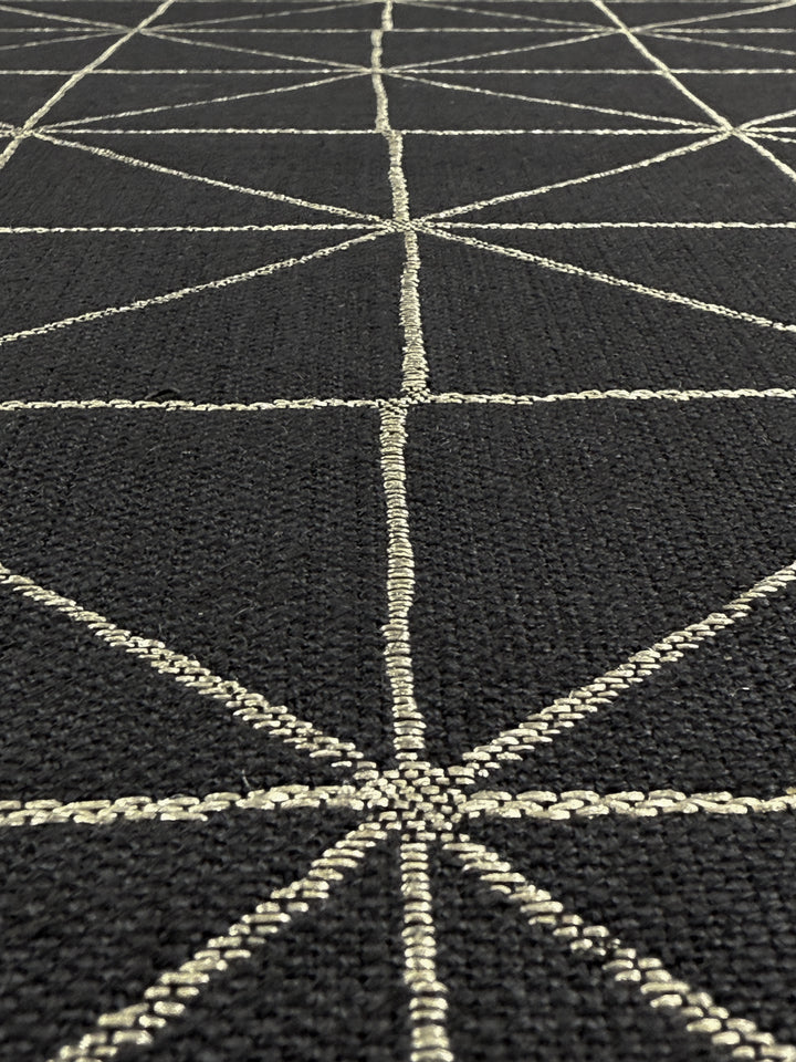Close-up of Super Cheap Fabrics' Linen Viscose - Quentin Coal (156cm): a heavy-weight blend featuring intersecting white stitched lines that form triangles and diamond shapes, adding depth and repetition to this upholstery fabric.