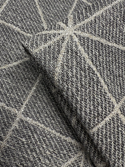 Close-up of Super Cheap Fabrics’ Linen Viscose - Quentin Silver (156cm), showcasing a soft, extra heavy weight fabric with a gray and white geometric pattern of intersecting lines. Limited stock available.