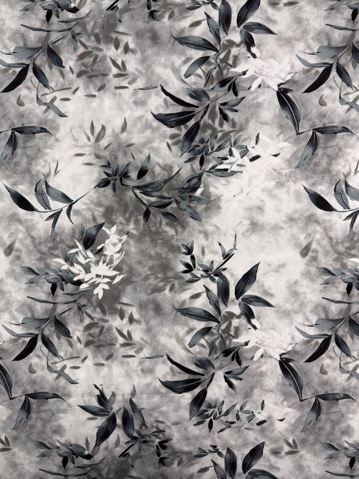 Designer Rayon - Misted Olive by Super Cheap Fabrics features an abstract grayscale floral pattern on a cloudy background, ideal for lightweight rayon fabric projects. Width: 147cm.