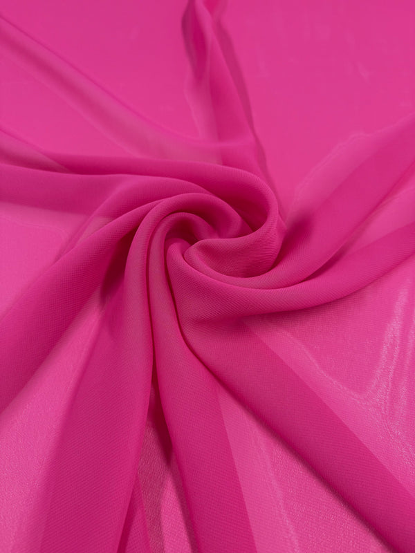 Super Cheap Fabrics' Hi-Multi Chiffon - Pink Peacock (150cm) is displayed in a spiral, highlighting its bright pink color, lightweight feel, and translucent texture.