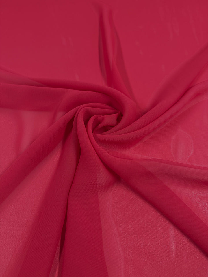 Hi-Multi Chiffon - Lollipop by Super Cheap Fabrics features sheer red fabric arranged in soft folds and gentle, flowing swirls. Lightweight and 150cm wide, it adds a delicate texture to any project.