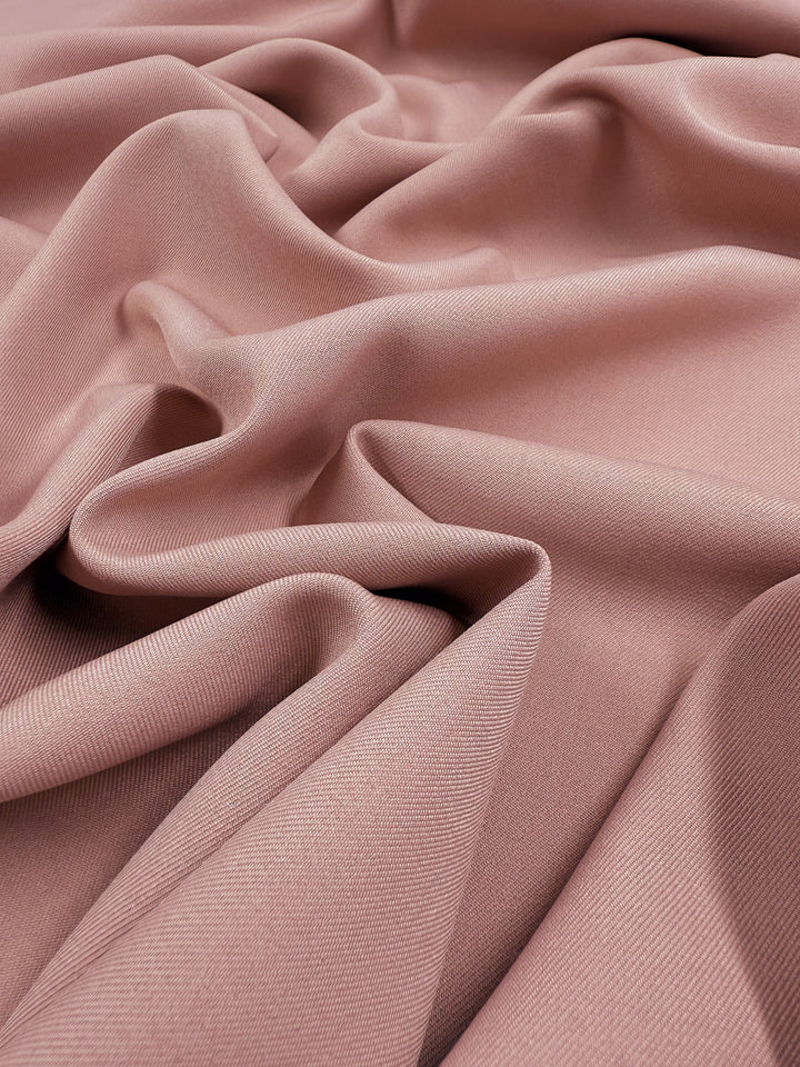 Liquid Twill - Misty Rose by Super Cheap Fabrics is a soft, dusty pink suiting fabric with a smooth finish and gentle drape, creating elegant movement across its 150cm width.