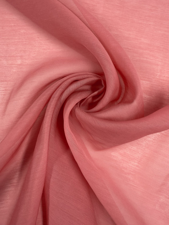 Super Cheap Fabrics’ Designer Voile - Rose of Sharon - 150cm is a smooth, lightweight pink fabric with a delicate texture and soft folds—perfect for elegant summer dresses.