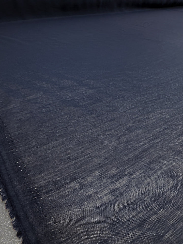 A close-up of Super Cheap Fabrics' Designer Voile in Pageant Blue (150cm): a lightweight, slightly shiny fabric with a subtle texture—ideal for summer dresses or designer voile projects.