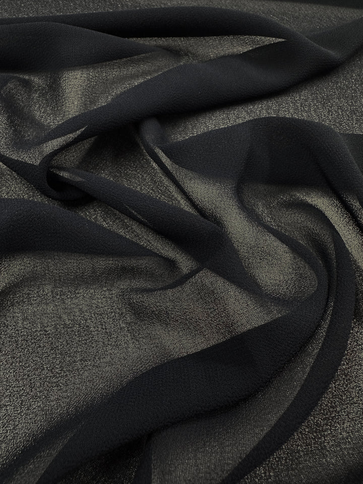Hi-Multi Chiffon - Navy by Super Cheap Fabrics is a sheer, slightly crinkled polyester fabric (150cm wide) that drapes softly and flows elegantly over light surfaces.