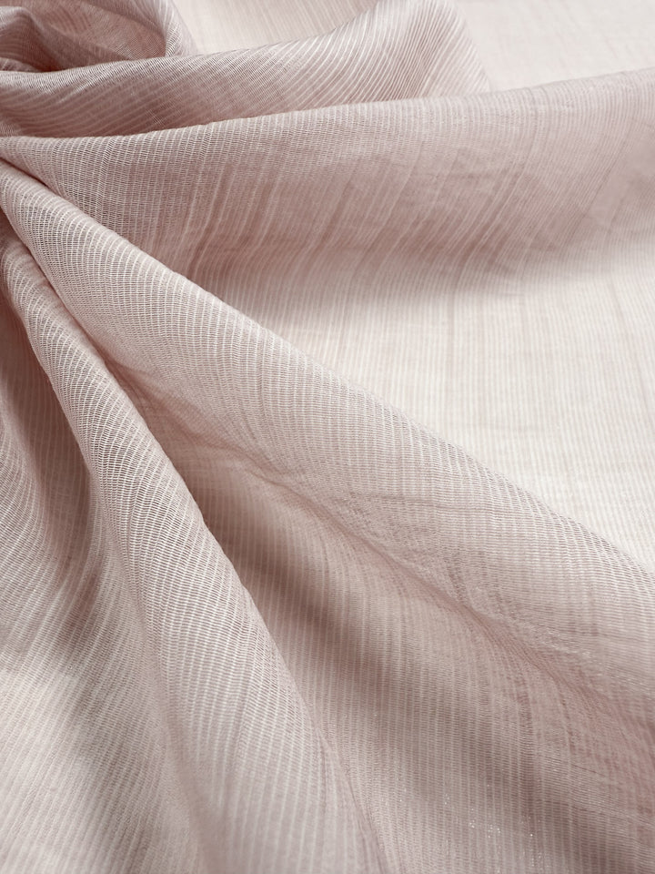 Super Cheap Fabrics’ Textured Designer Voile - Sepia Rose (155cm) is a sheer, light pink fabric with fine lines and a soft drape, ideal for summer dresses and lightweight cotton styles.