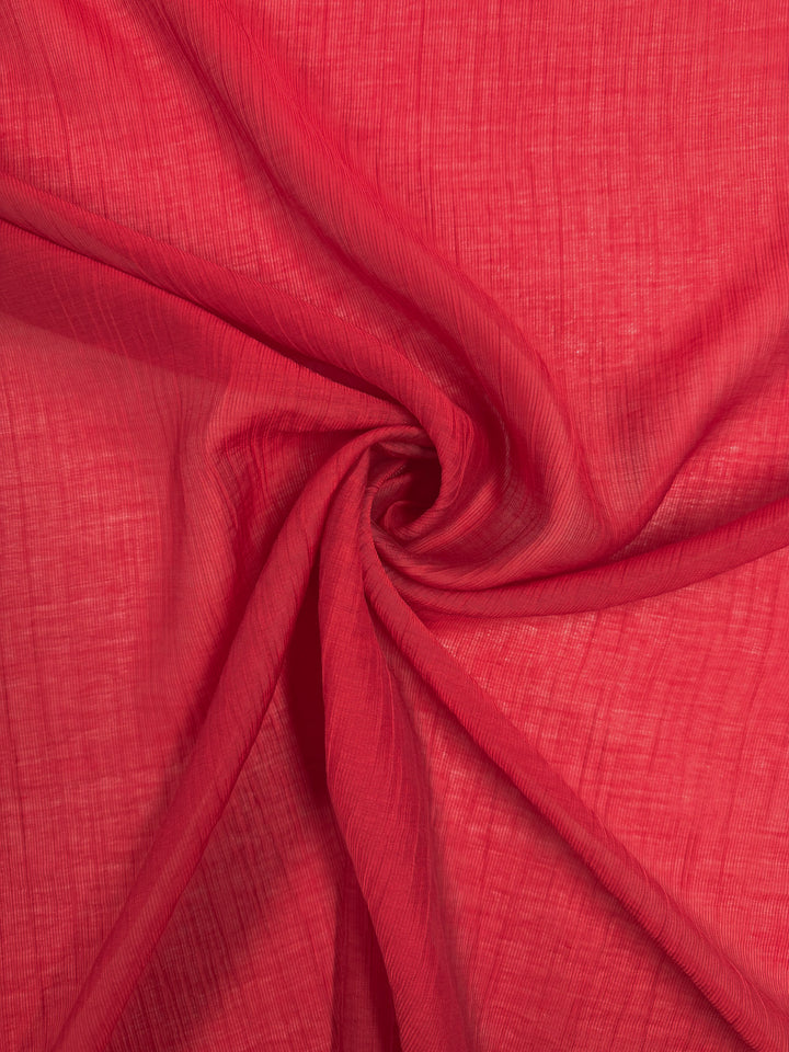 Textured Designer Voile - True Red (155cm) by Super Cheap Fabrics features a bright red, semi-sheer fabric with subtle grid and soft folds—ideal for lightweight summer looks.