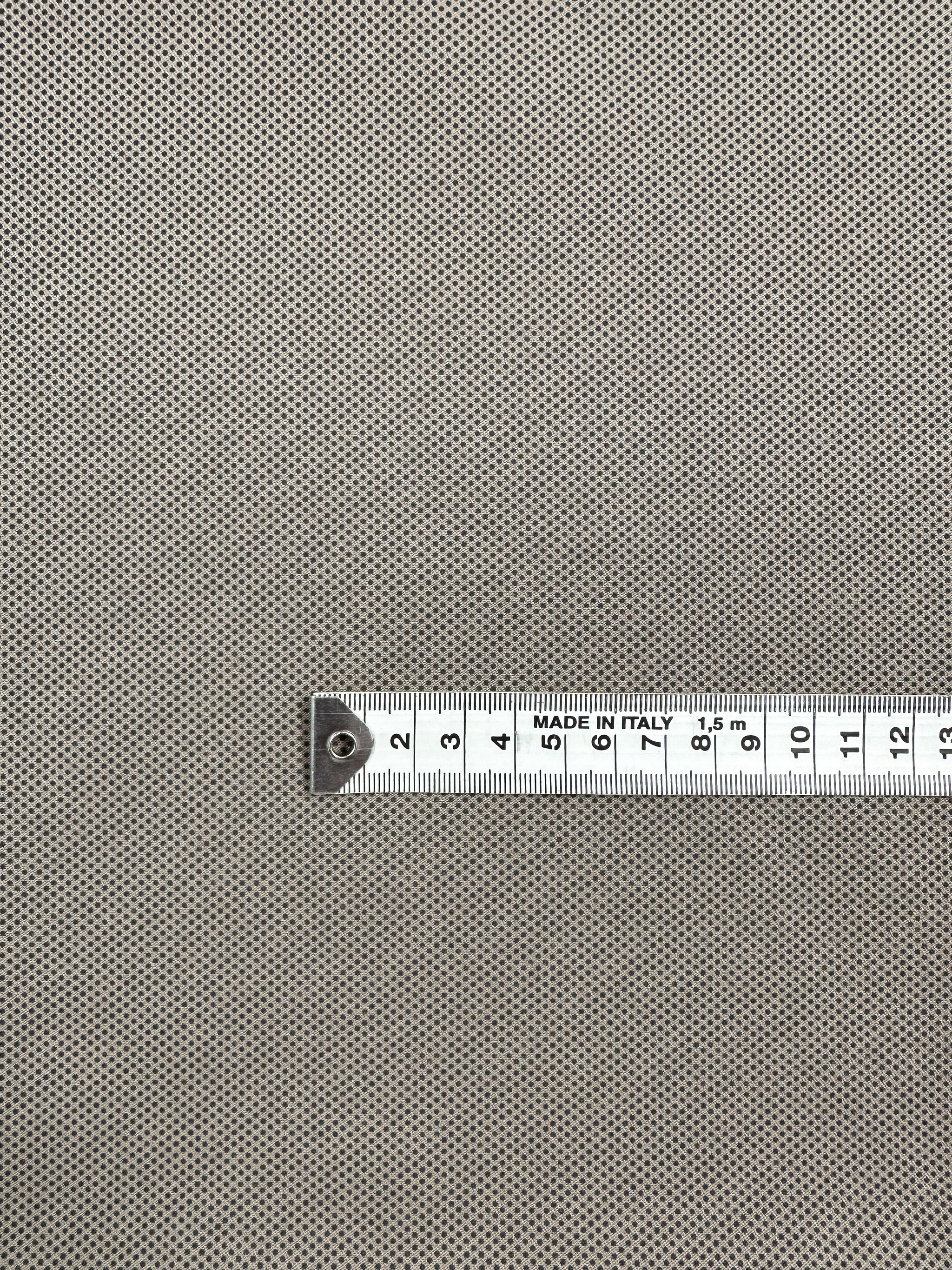 A close-up of the Printed Bengaline - Pin Dot Sand by Super Cheap Fabrics shows a comfortable, structured fabric with fine dots. A silver tape marked 