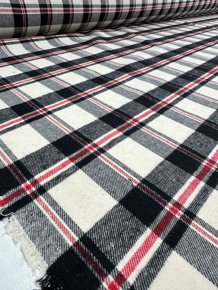 A close-up of Suiting - Black Watch Plaid by Super Cheap Fabrics (147cm), showing its textured weave and unfinished edge.