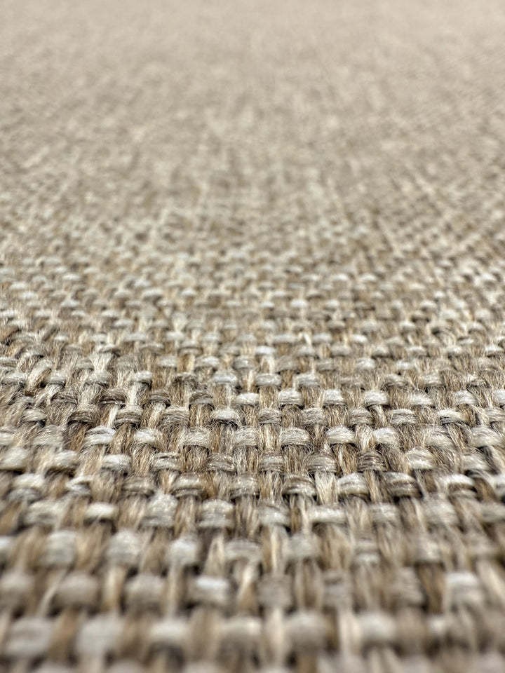 Close-up of Super Cheap Fabrics' Upholstery - Soho Cinnamon - 150cm, showing textured wool-look fabric in beige and brown fibers. The detailed, medium weight weave stands out against a softly blurred background.