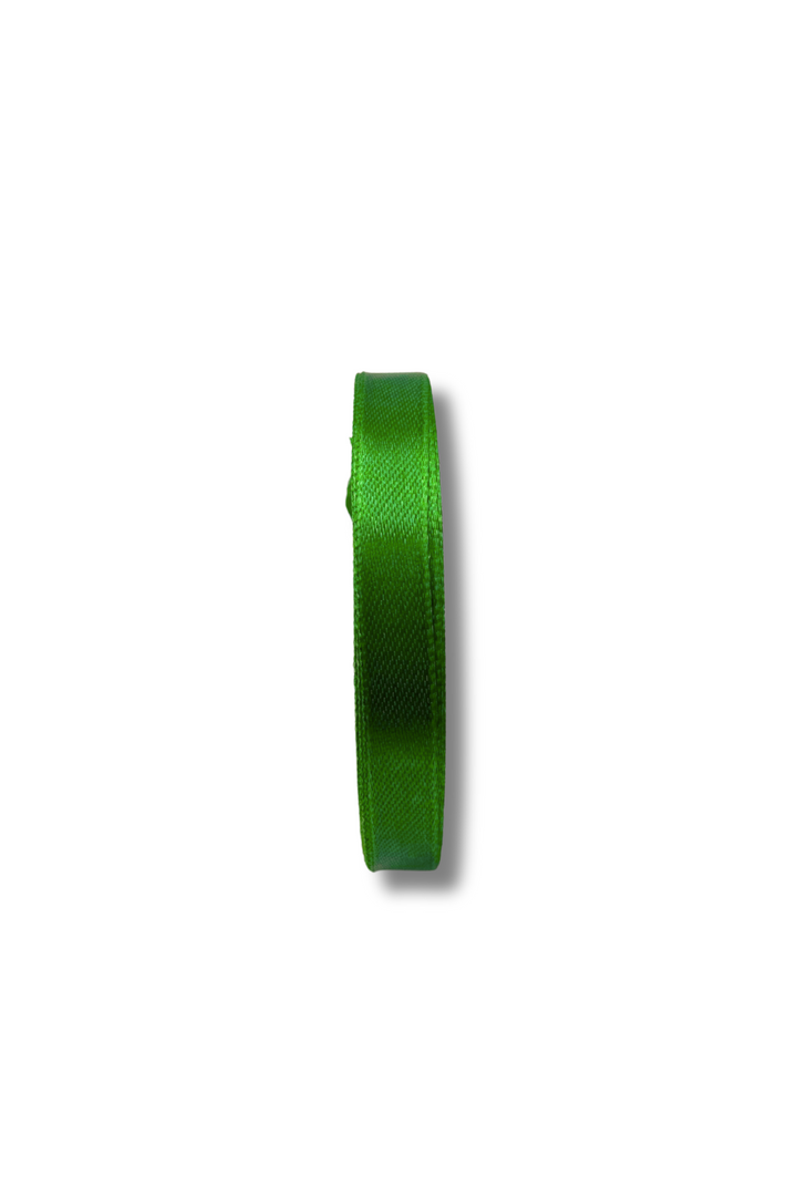 A roll of Super Cheap Fabrics Satin Ribbon - 10 Colours - 10mm, 21mt long, in shiny green, shown side-on against a white background with a slight shadow to the right.
