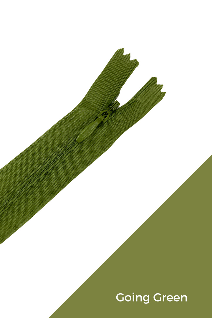 A partially open Invisible Zip - 30cm - Greens by Super Cheap Fabrics lies on a white and green background, with the text "Going Green" in the bottom right corner.