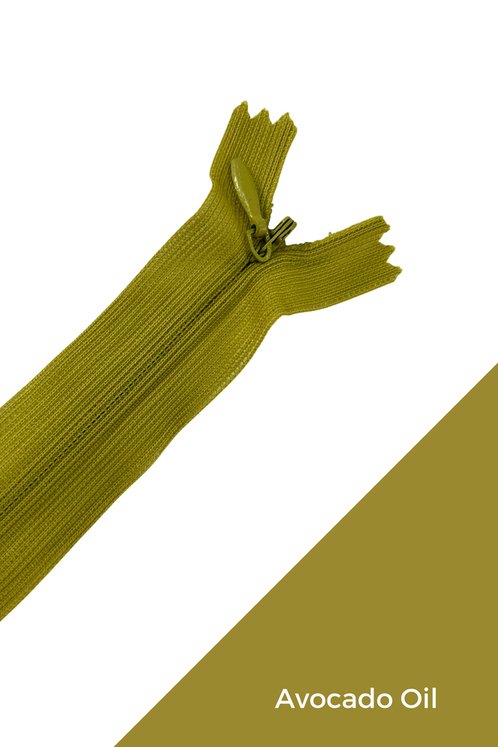 A close-up of the Super Cheap Fabrics Invisible Zip - 30cm - Greens in olive-green polyester, shown on a white and olive-green background with "Avocado Oil" in white text at the bottom right.