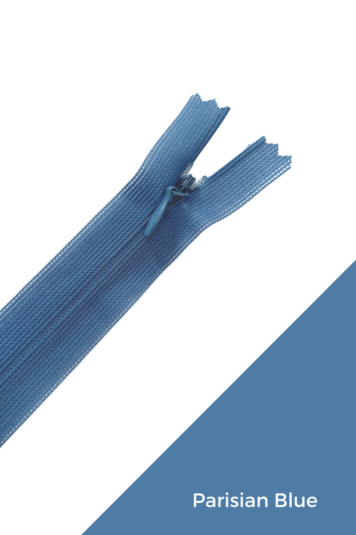 Image of a Parisian Blue-colored Invisible Zip - 30cm - Blues by Super Cheap Fabrics against a white and Parisian Blue color-block background. The zipper is partially open, revealing the zipper teeth and pull tab in the same elegant shade of blue.