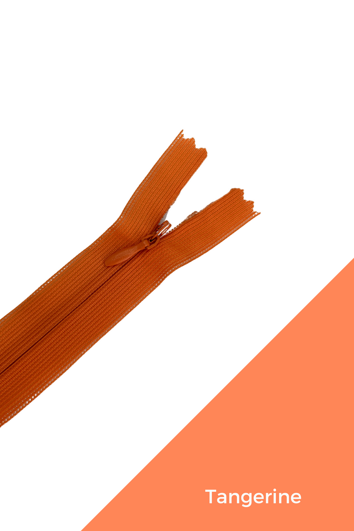 An image of the "Invisible Zip - 30cm - Yellows & Oranges" by Super Cheap Fabrics, partially unzipped against a white background. The lower right corner features a diagonal tangerine-colored section with the word "Tangerine" written in elegant white text.